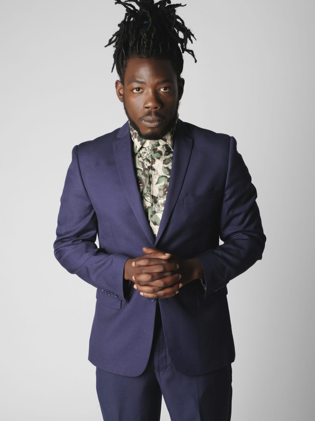 Official image of Musical Artist D. Denzel in a Purple Coat