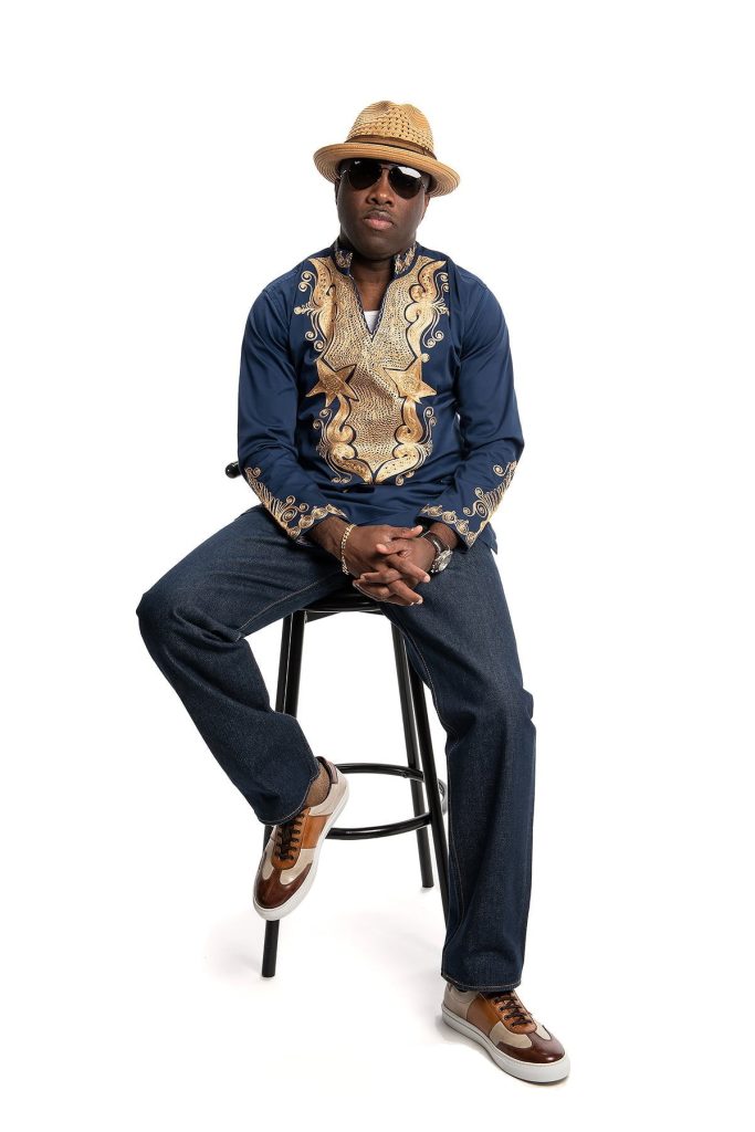 NANA KOTTENS official picture in hd sitting on a chair with white background