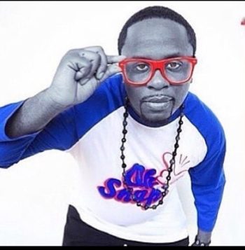 Dj Ricky Banks picture in blue & white shirt with red contact lenses