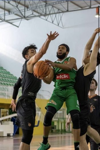 Official picture of Eugene Campbell III while scoring a goal during a Basketball game