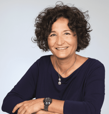 photo of liz ruiz, a woman, wearting a black shirt and a watch on her left arm