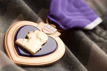 Purple Heart War Medal on Camouflage Material