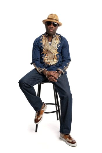 NANA KOTTENS official picture in hd sitting on a chair with white background