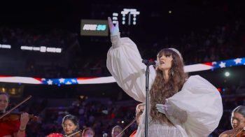 Radmila Lolly official image while singing the Anthem