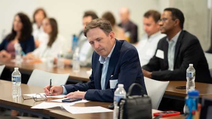 Tad Piper In Executive Meeting